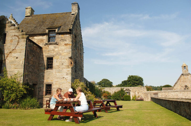 Visiters Enjoy A Cup Of Tea Outside Aberdour Castle Aberdour Fife