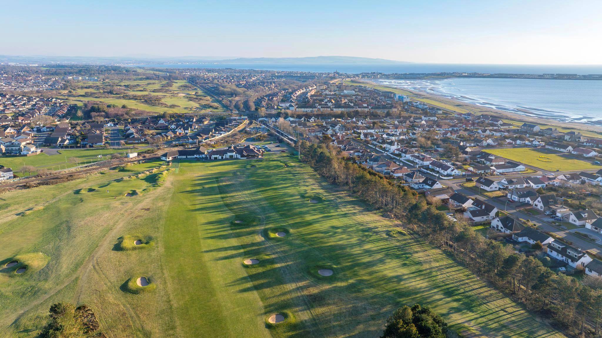 From the air, looking across the golf course to town of Troon and out to sea.