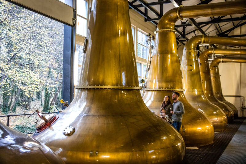 Glen Ord The Nearest Distillery To Inverness Loch Ness In The Highlands Of Scotland  A Couple Standing Next To The Copper Stills