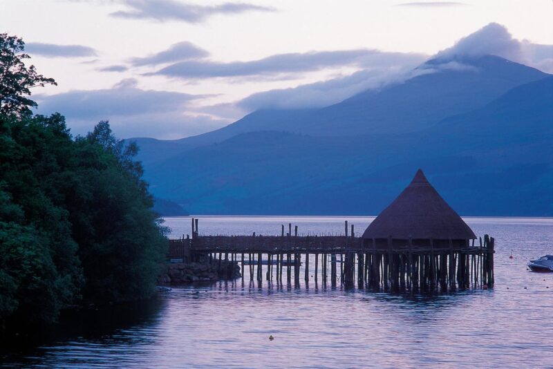 Looking Along The Shoreline Of Loch Tay To The Scottish Crannog Centre At Kenmore Perth And Kinross