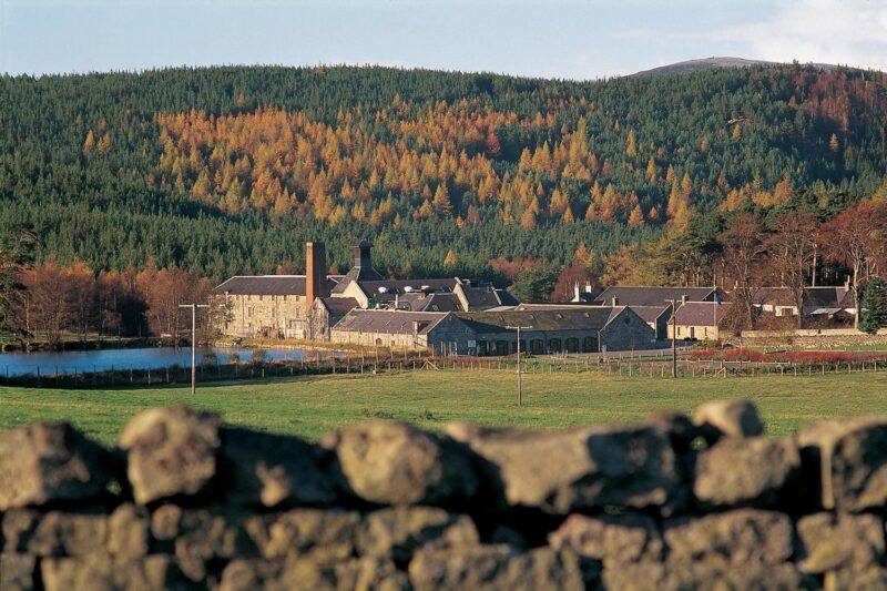 Looking Over A Dry Stone Wall To The Royal Lochnagar Whisky Distillery