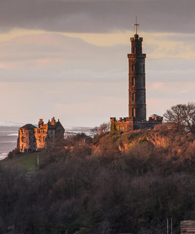 The monuments on top of Calton Hill, lit by a rising sun