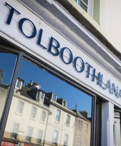 The outside of the Tolbooth, the window and sign above