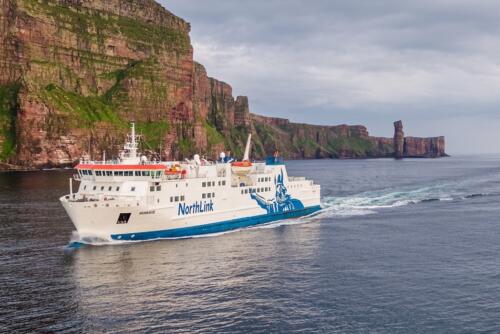 The Northlink Ferry sails past the Old Man of Hoy and the cliffs