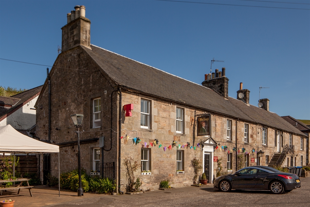A traditional country pub decorated with bunting